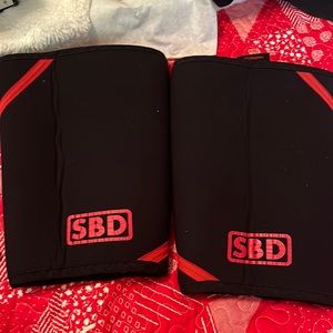 Black and red sbd knee sleeves